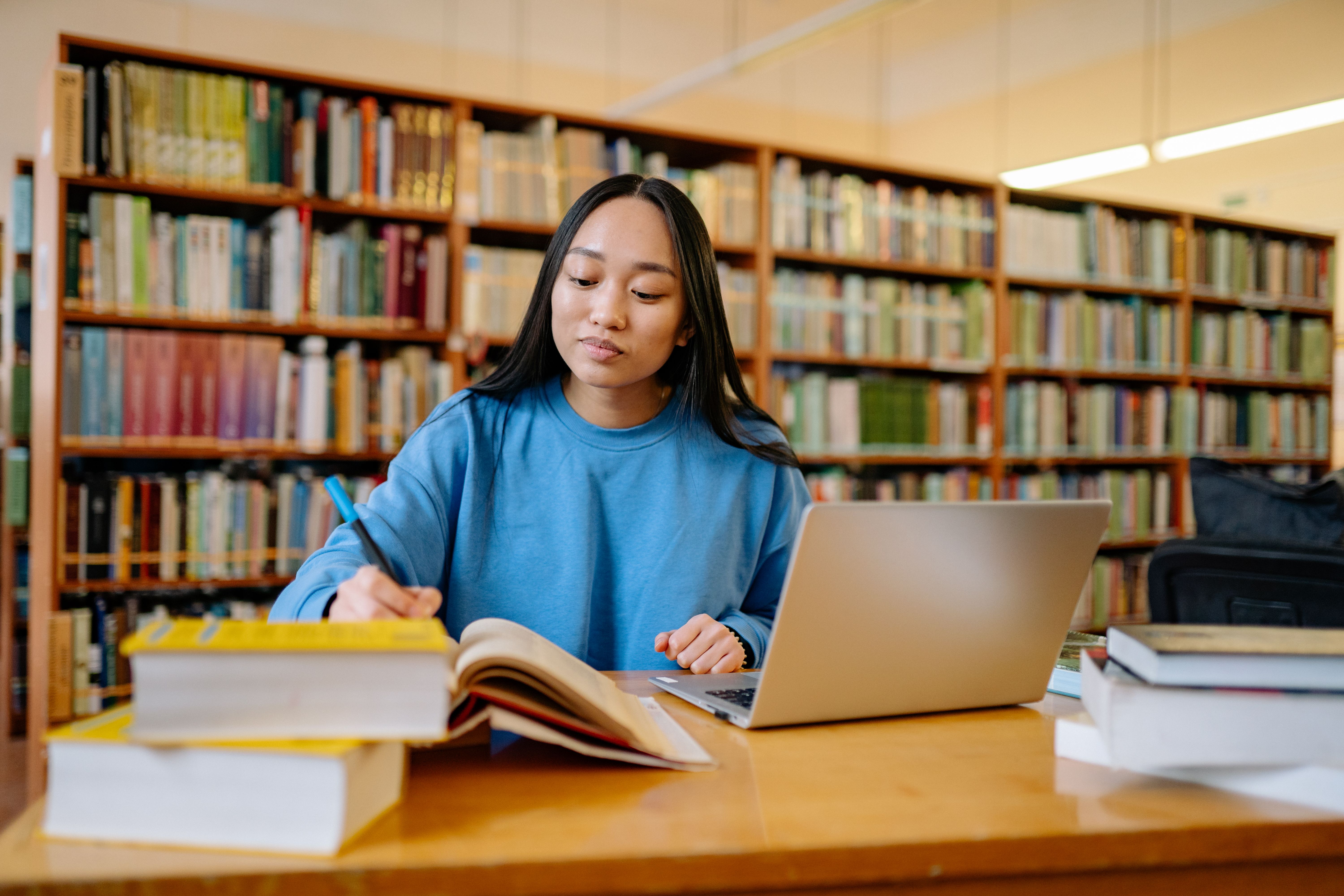 Asian woman studying in library